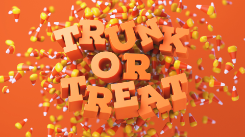 Orange Trunk or Treat text with orange background and candy corn 