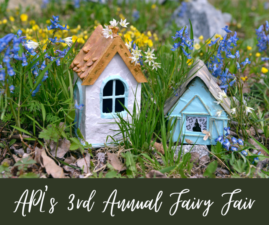 Fairy Houses in grass with flowers